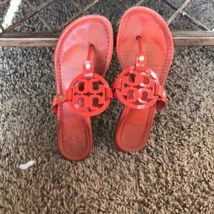 orange Tory Burch Miller sandals.